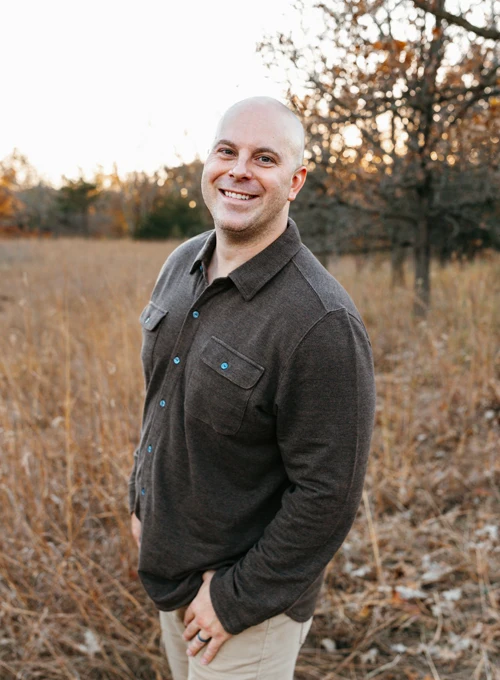 Ian McCann smiling outside.